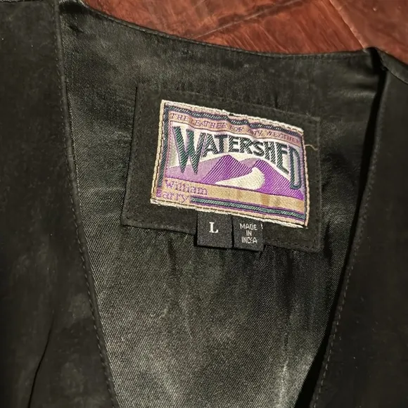 Watershed leather vest black side like leather with silky back adjustable back